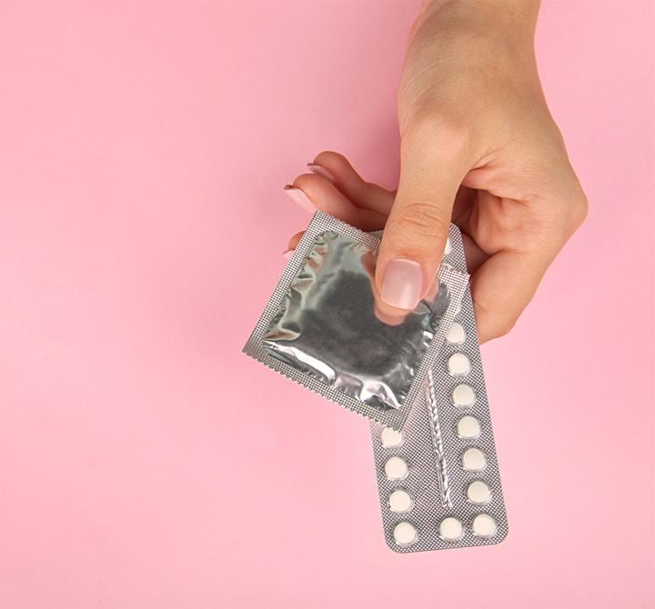 Hand holding contraceptives